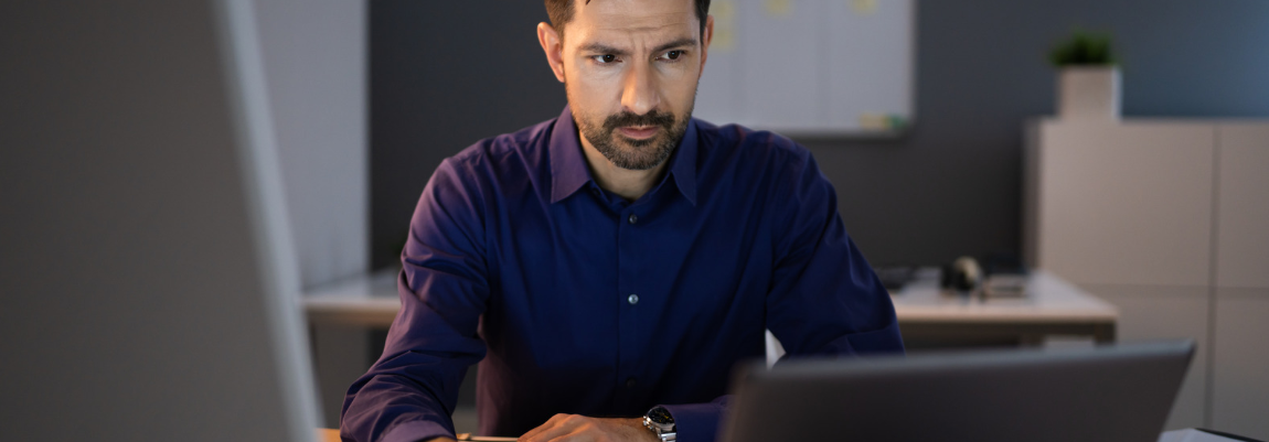 Man working on a laptop in an office